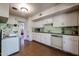 Vintage kitchen with retro appliances and white cabinetry, offering a glimpse into a bygone era of home design at 4142 N 35Th St, Phoenix, AZ 85018