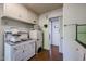 A vintage kitchen with white cabinets and retro appliances, creating a nostalgic and functional cooking space at 4142 N 35Th St, Phoenix, AZ 85018