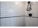 Modern shower with white subway tile and black hardware at 4142 N 35Th St, Phoenix, AZ 85018