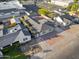An aerial view of the property showing the landscaping, driveway, and nearby buildings at 432 W 1St St, Mesa, AZ 85201
