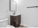 Modern bathroom vanity with sink, mirror, and dark wood cabinetry at 432 W 1St St, Mesa, AZ 85201