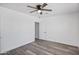 Neutral bedroom with ceiling fan, wood-look flooring and closet at 432 W 1St St, Mesa, AZ 85201
