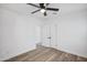 Bedroom with double doors, wood floors, and light from adjacent areas at 432 W 1St St, Mesa, AZ 85201