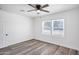 Sunny bedroom with wood-look flooring, ceiling fan and natural light at 432 W 1St St, Mesa, AZ 85201