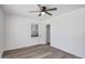 Bright bedroom with wood-look flooring, ceiling fan and neutral paint at 432 W 1St St, Mesa, AZ 85201
