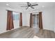 Spacious bedroom features a ceiling fan, recessed lighting, and wood-look flooring at 432 W 1St St, Mesa, AZ 85201