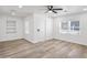 Inviting bedroom with wood-look floors, a ceiling fan, and ample natural light at 432 W 1St St, Mesa, AZ 85201
