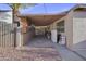 Covered parking includes a large storage cabinet and access to backyard at 432 W 1St St, Mesa, AZ 85201