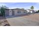 Charming single-story home featuring a gated entry and low-maintenance landscaping at 432 W 1St St, Mesa, AZ 85201