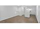 Open living space and kitchen with wood flooring and white walls at 432 W 1St St, Mesa, AZ 85201