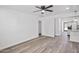 Spacious living area with wood-look flooring and an open layout to the kitchen at 432 W 1St St, Mesa, AZ 85201