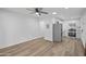 Open-concept living room with wood-look flooring leads to a fully-equipped kitchen at 432 W 1St St, Mesa, AZ 85201