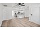 Bright, open living space with modern ceiling fan and seamless flow into kitchen at 432 W 1St St, Mesa, AZ 85201