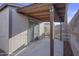 Covered patio features sliding glass doors and block wall at 432 W 1St St, Mesa, AZ 85201
