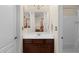 Bathroom with a wood vanity, a white countertop, and a large mirror at 4347 N 24Th Way, Phoenix, AZ 85016