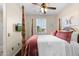 Bedroom with a four-poster bed, a ceiling fan, and a window with light-filtering shutters at 4347 N 24Th Way, Phoenix, AZ 85016