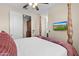 Bedroom featuring a four-poster bed and a TV mounted to the wall at 4347 N 24Th Way, Phoenix, AZ 85016