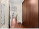 Hallway with hardwood floors, access to rooms, and large wooden wardrobe/cabinet at 4347 N 24Th Way, Phoenix, AZ 85016