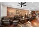 Spacious living room features exposed brick wall, hardwood floors and plush seating at 4347 N 24Th Way, Phoenix, AZ 85016