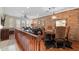 Open-concept living space with dining area, exposed brick wall, and hardwood floors at 4347 N 24Th Way, Phoenix, AZ 85016