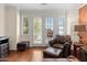 Bright living room features doors leading to an outdoor balcony at 4347 N 24Th Way, Phoenix, AZ 85016
