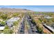 Aerial view of the neighborhood, showcasing palm-lined streets and scenic mountain backdrop at 4396 N School Hill Rd, Buckeye, AZ 85396