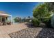 Spacious backyard featuring a pool, outdoor dining set, mature trees, a grill and an open patio, perfect for relaxing at 4396 N School Hill Rd, Buckeye, AZ 85396