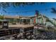 Spacious backyard features a pool, outdoor dining and lounge areas, and lush landscaping, offering the perfect outdoor retreat at 4396 N School Hill Rd, Buckeye, AZ 85396