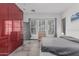 Stylish bedroom with tile flooring, neutral walls, and natural light, featuring a minimalist design and ample closet space at 4396 N School Hill Rd, Buckeye, AZ 85396