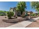 Charming two-story home with stone accents and well-maintained landscaping at 4396 N School Hill Rd, Buckeye, AZ 85396