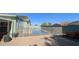Backyard pool featuring a safety fence, patio furniture, and a well maintained deck, creating a serene outdoor oasis at 4396 N School Hill Rd, Buckeye, AZ 85396