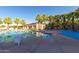 Resort-style pool with palm trees, splash pad, and comfortable lounge seating at 4396 N School Hill Rd, Buckeye, AZ 85396