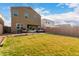 Spacious backyard features a hammock, covered patio with seating, and a grill, perfect for outdoor living at 4580 E Gagarinite Ln, San Tan Valley, AZ 85143