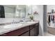Bright bathroom featuring dual sinks, granite countertops and a spacious walk-in closet at 4580 E Gagarinite Ln, San Tan Valley, AZ 85143