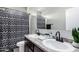 Modern bathroom featuring dual sinks, granite countertops, and updated fixtures at 4580 E Gagarinite Ln, San Tan Valley, AZ 85143