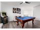 Spacious game room with a pool table and an arcade machine for entertainment at 4580 E Gagarinite Ln, San Tan Valley, AZ 85143
