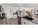 Bright kitchen area with stainless steel appliances, granite counters, and an island sink at 4580 E Gagarinite Ln, San Tan Valley, AZ 85143