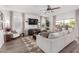 Bright and airy living room with a ceiling fan and lots of natural light at 4580 E Gagarinite Ln, San Tan Valley, AZ 85143