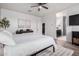 Cozy main bedroom with a view to an ensuite bathroom and a walk-in closet at 4580 E Gagarinite Ln, San Tan Valley, AZ 85143