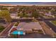 An aerial view of a house with a private backyard swimming pool surrounded by mature landscaping at 4596 E Calle Ventura --, Phoenix, AZ 85018