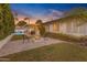 Inviting backyard with a fire pit and covered patio, ideal for outdoor living and relaxation at 4596 E Calle Ventura --, Phoenix, AZ 85018