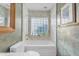 This bathroom features a bathtub with a glass block window at 4596 E Calle Ventura --, Phoenix, AZ 85018