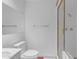 A modern bathroom features a glass shower, toilet, and sink with white cabinets and chrome fixtures at 4596 E Calle Ventura --, Phoenix, AZ 85018