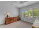 A bedroom with carpet flooring, ceiling fan, lots of natural light, and large storage unit at 4596 E Calle Ventura --, Phoenix, AZ 85018
