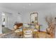 Charming dining area with a glass table, stylish seating, and large mirror accent at 4596 E Calle Ventura --, Phoenix, AZ 85018
