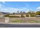 An exterior front view of a single story house with a manicured front yard and mature landscaping at 4596 E Calle Ventura --, Phoenix, AZ 85018