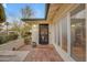 Charming front entrance with a tiled porch and a stylish glass-paneled front door at 4596 E Calle Ventura --, Phoenix, AZ 85018