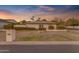 Charming home featuring a well-manicured front yard and a welcoming facade at dusk at 4596 E Calle Ventura --, Phoenix, AZ 85018