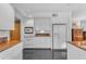 Open kitchen features white cabinets, granite countertops, and stainless steel appliances at 4596 E Calle Ventura --, Phoenix, AZ 85018