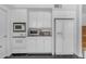 Detailed view of white cabinets, modern appliances, and ample countertop space at 4596 E Calle Ventura --, Phoenix, AZ 85018